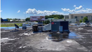 Commercial roofing contractor performing an inspection to demonstrate commercial roof inspection benefits for a business property