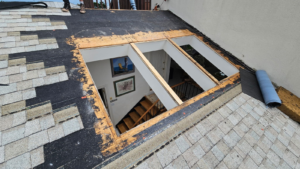 Hidden roof damage Virginia Beach VA showing moisture intrusion and roof deterioration beneath shingles