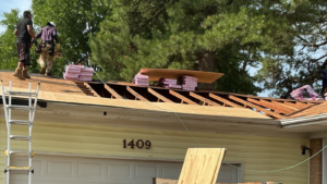 Learning Center 38 roof decking replacement Virginia Beach VA showing damaged roof sheathing being replaced during a roof installation