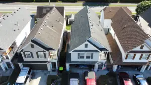 Learning Center 37 Drone performing an aerial roof inspection to identify hidden roof damage before purchasing a home