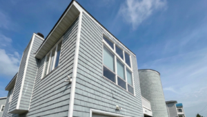 Chesapeake 25 unique siding design ideas on a modern home exterior with mixed materials and bold color accents