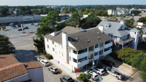 commercial roof inspection Virginia Beach inspector checking flat roof membrane