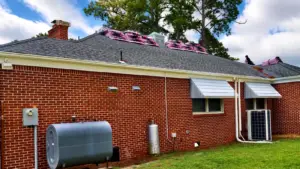 roof replacement Virginia Beach crew preparing a roof before new shingle installation